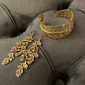 Gold cuff bracelet and earrings